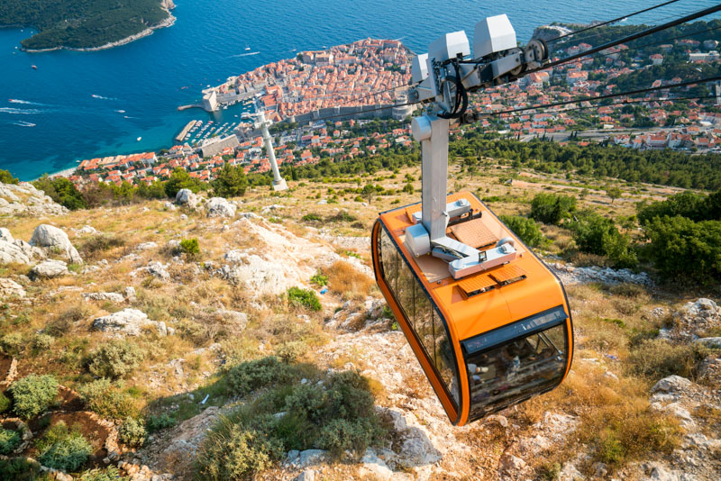 Enjoy stunning views of Dubrovnik from the cable car, overlooking the Adriatic Sea.