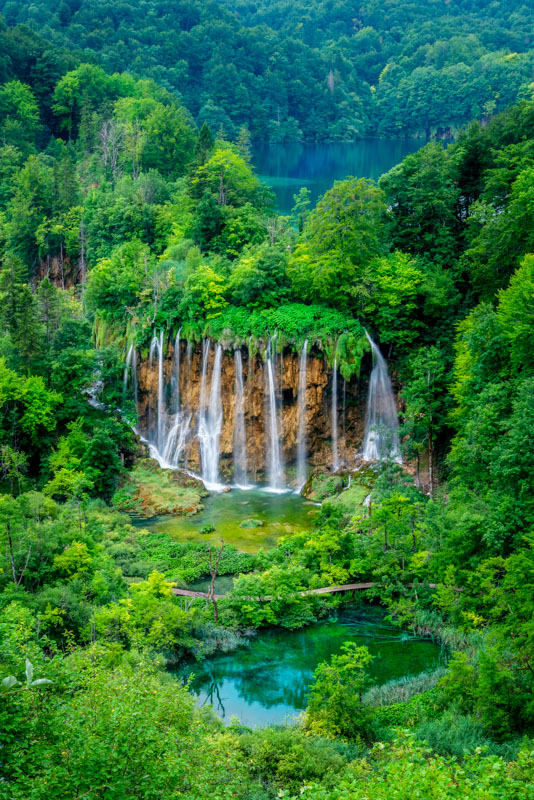 Plitvice Lakes National Park is a fairytale destination with cascading waterfalls, clear lakes, and lush greenery.